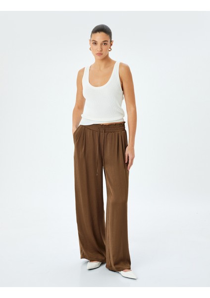 Bel Bağlamalı Lastikli Cepli Saten Palazzo Pantolon fiyatları