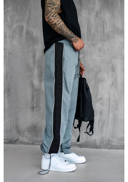 Erkek Şeritli Baggy Fit Teknik Pantolon Gri fırsatları