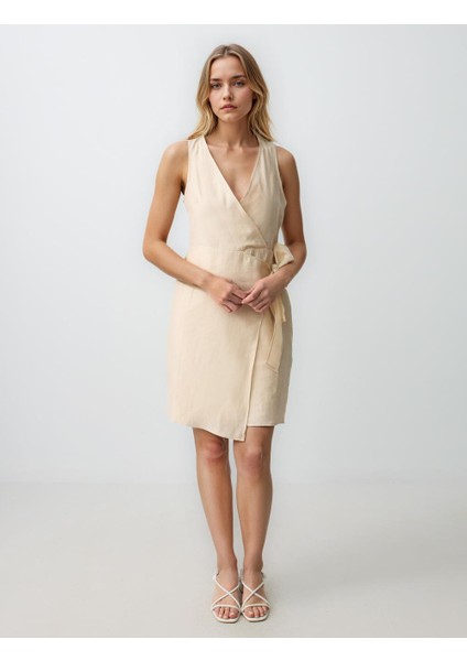 Ekru V Yaka Kolsuz Fiyonk Detaylı Dokuma Mini Elbise fiyatları