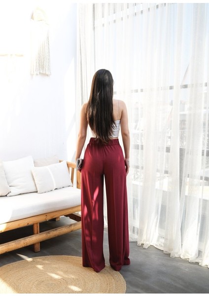 Keten Önü Çapraz Parçali Lasti̇kli̇ ve Bağcikli Geni̇ş Paça Pantolon