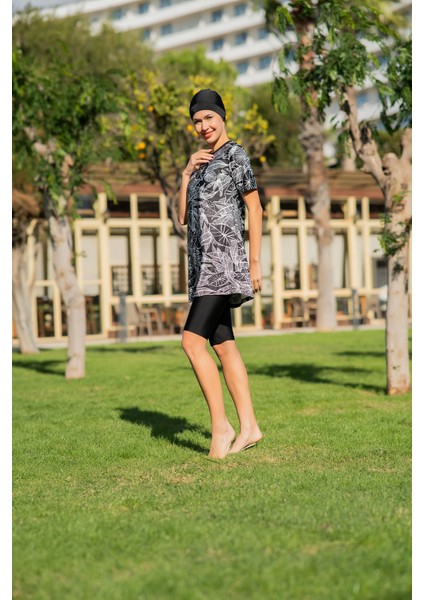 Siyah Yaprak Desenli Yarım Kol Micro (Esnek ve Çabuk Kuruyan) Kumaş Yarı Tesettür Mayo modelleri