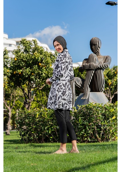 Siyah Beyaz Yaprak Desenli Balıkçı Yaka Micro (Esnek ve Çabuk Kuruyan) Kumaş Tesettür Mayo modelleri