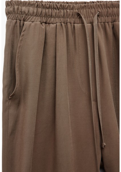 Viskon Cupro Kumaş Beli Bağcıklı Cepli Bol Paça Pantolon modelleri