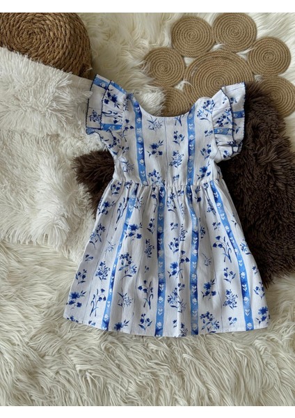 Kız Çocuk Mavi Beyaz Çiçekli Arkası Düğmeli Kolları Fırfırlı Beli Lastikli Pamuklu Dokuma Elbise fırsatları