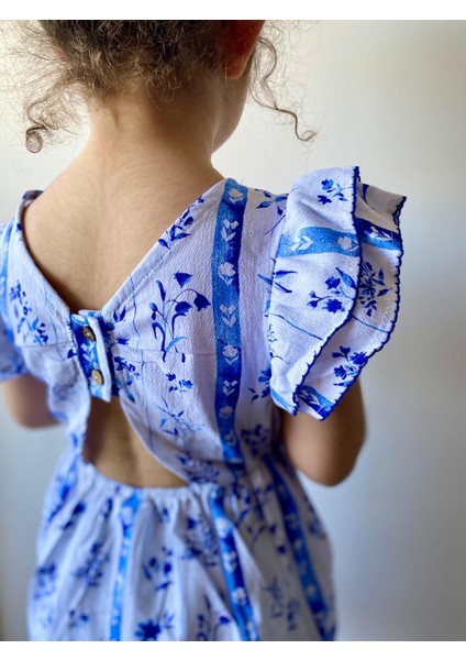 Kız Çocuk Mavi Beyaz Çiçekli Arkası Düğmeli Kolları Fırfırlı Beli Lastikli Pamuklu Dokuma Elbise fiyatları