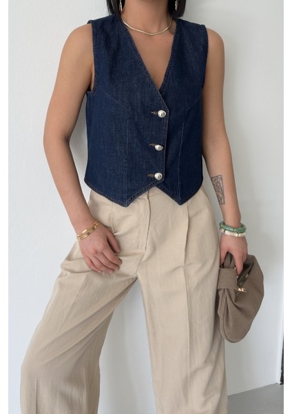 Düğmeli ve Kısa Boylu Dar Kalıplı Cepsiz Kolsuz Kadın Kot Yelek Slaplı Lacivert Denim