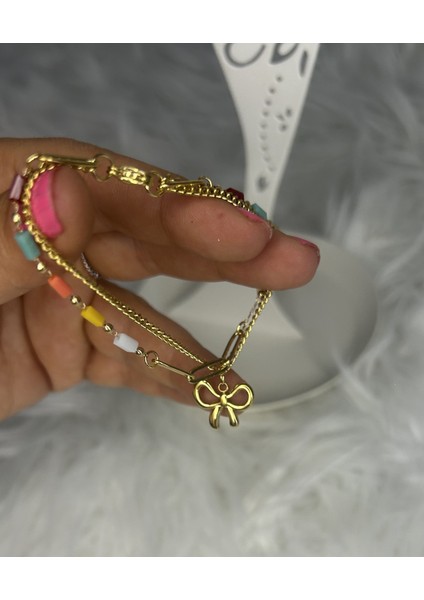 Badelis Çelik Gold Renkli Boncuk ve Fiyonk Detaylı Bileklik fırsatları