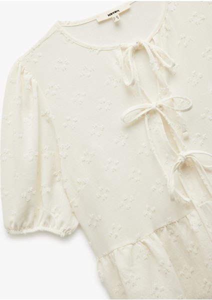 Dokulu Kısa Balon Kollu Fiyonklu Önden Bağcıklı Bluz indirimleri