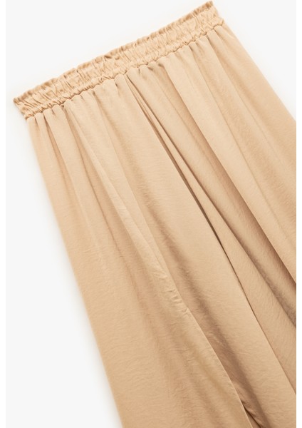 A Kesim Yırtmaç Detaylı Midi Boy Saten Kloş Etek modelleri