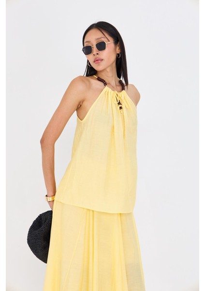 Sıfır Kollu Boncuk Detaylı Halter Yaka Bluz indirimleri