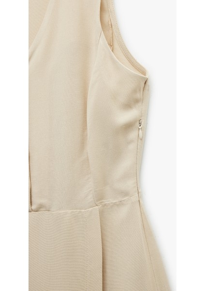 V Yaka Kolsuz Düğmeli Keten Karışımlı Mini Tulum fırsatları