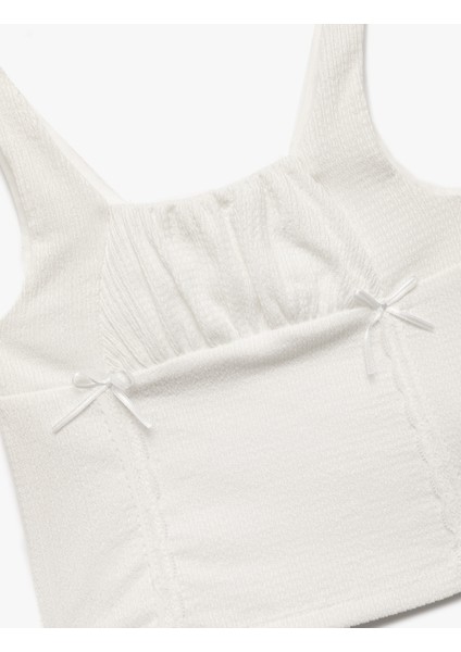 Bürümcük Kumaş Slim Fit Kare Yaka Fiyonk Detaylı Kolsuz Askılı Crop Bluz modelleri