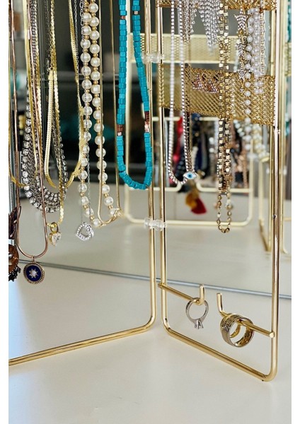 Altın tonlu metal takı ve aksesuar düzenleyici standı, şık ve pratik kullanım sağlar modelleri