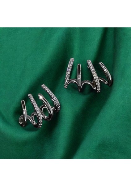 Kadınlar Için Zirkon Taşlı Gümüş Renkli Tasarım Pençe Model Küpe fırsatları