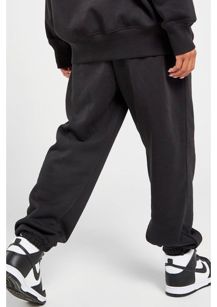 Sportswear Phoenix Fleece Oversize High Rise Pants Kadın Oversize Yüksek Belli Şardonlu Eşofman Altı Siyah fiyatları