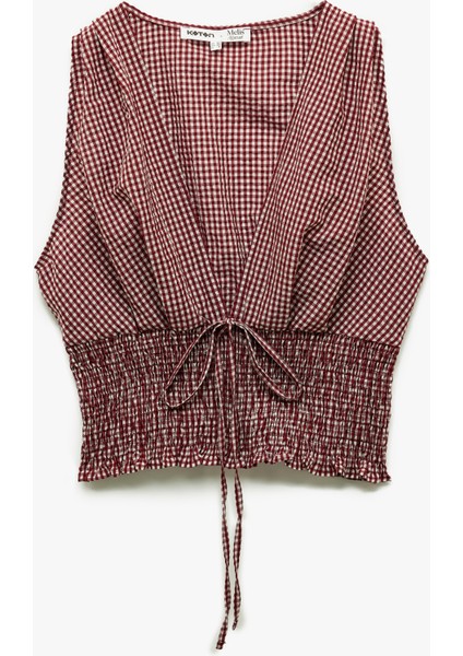 x Melis Ağazat - Kolsuz V Yaka Fiyonklu Gipeli Pötikareli Kısa Bluz