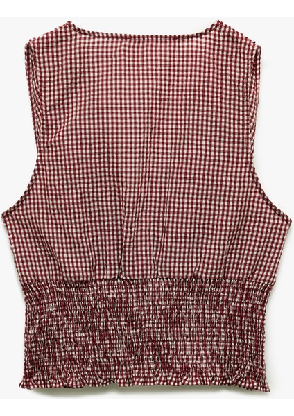 x Melis Ağazat - Kolsuz V Yaka Fiyonklu Gipeli Pötikareli Kısa Bluz fiyatları