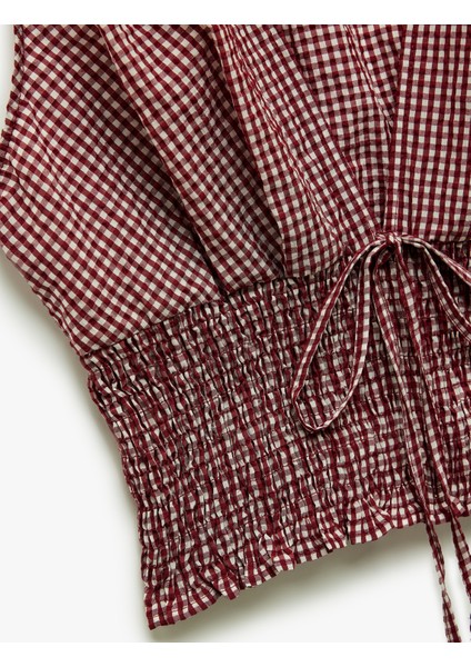 x Melis Ağazat - Kolsuz V Yaka Fiyonklu Gipeli Pötikareli Kısa Bluz modelleri