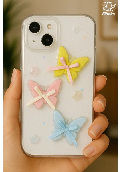 Apple iPhone 13 - 14 - 15 Kılıf Şeffaf Simli Renkli 3D Kelebek Desenli Fiyonk Kurdale Silikon Kapak fiyatları