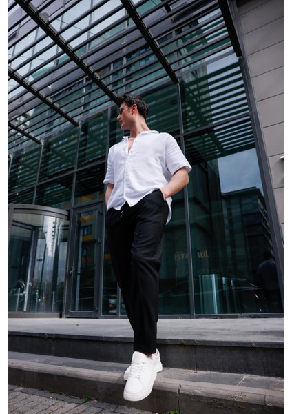 Erkek Siyah Renk Esnek Likralı Fermuar Detaylı Jogger Pantolon fiyatları