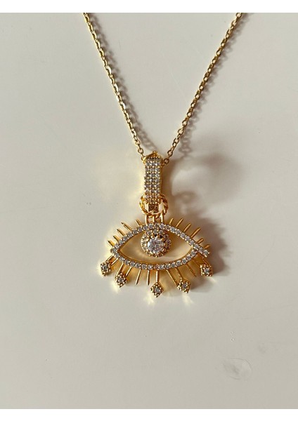 Gold Renk Göz Figürlü Zirkon Taşlı Çelik Kolye ve Sallantılı Halka Küpe Seti fırsatları