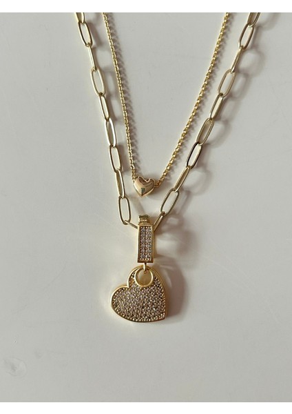 Gold Renk Paslanmaz Çelik Inci Boncuk Zincirli Kalp Sallantılı Kolye, Beyaz Zirkon Taşlı Kalp Sallantılı Çivi Küpe ve Kalp Detaylı Charm Bileklik 3’lü Set
