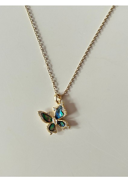 Lacivert Kelebek Figürlü Gold Renk Paslanmaz Çelik Kolye ve Zümrüt Zirkon Taşlı Sallantılı Gold Renk Çivi Kapamalı Çelik Küpe Seti modelleri