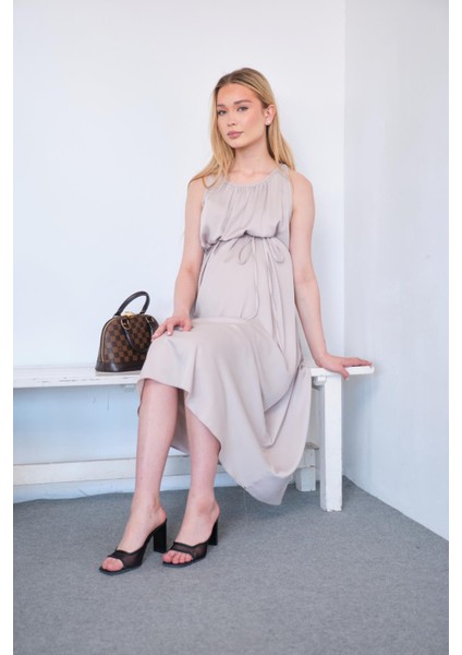 Hamile Beli Bağcıklı Sıfır Kol Midi Boy Saten Elbise Bej fiyatları