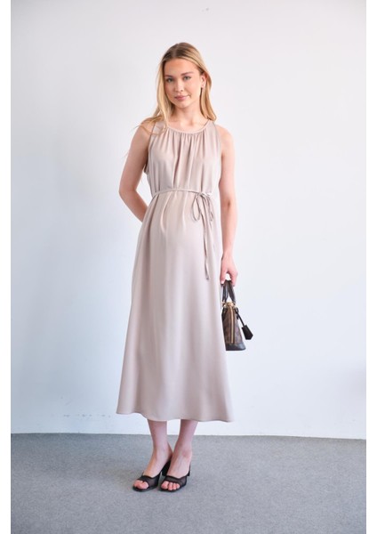 Hamile Beli Bağcıklı Sıfır Kol Midi Boy Saten Elbise Bej indirimleri