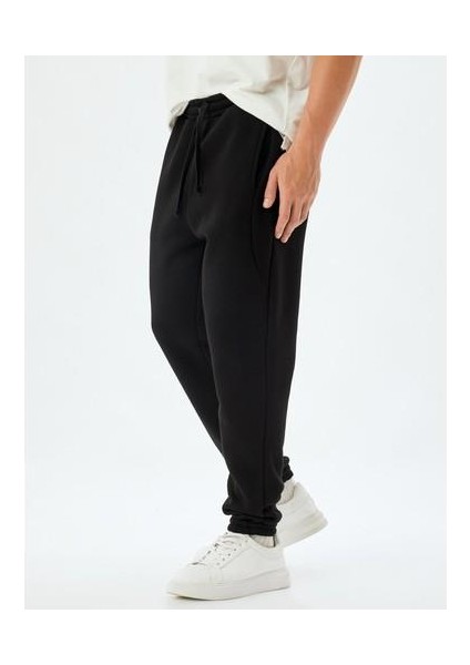 Eşofman Altı Beli Bağcıklı Dikiş Detaylı Cepli Pamuk Karışımlı Lastikli Paça Şardonlu modelleri