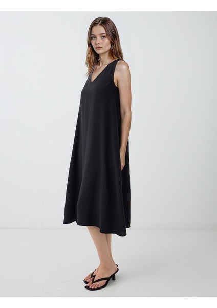 Siyah V Yaka Bol Kesim Dokuma Elbise fiyatları