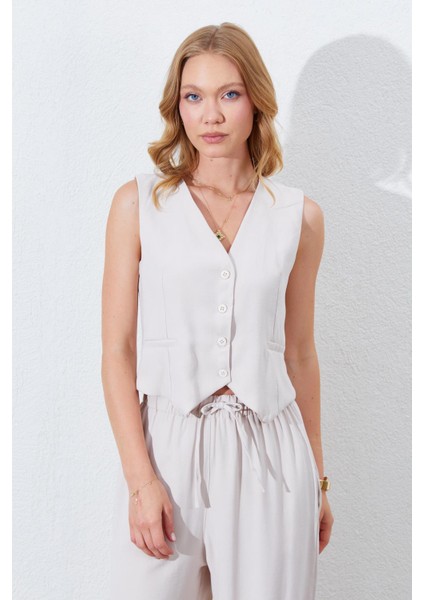 Kadın Açık Bej Fleto Cepli Arkası Gipeli Yelek