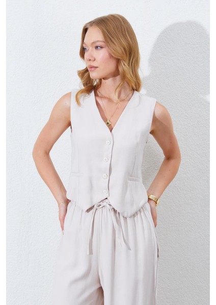 Kadın Açık Bej Fleto Cepli Arkası Gipeli Yelek modelleri