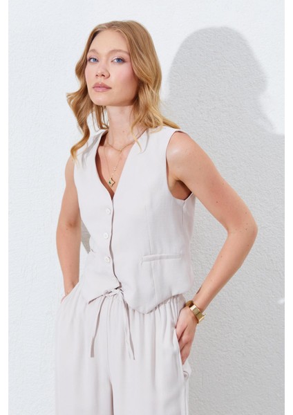 Kadın Açık Bej Fleto Cepli Arkası Gipeli Yelek fırsatları