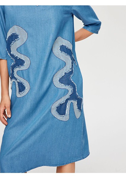 Soyut Aplike Detaylı V Yaka Tenselli Jean Elbise S25JEL001