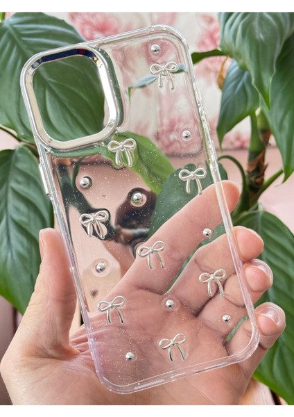 Apple iPhone 16 Plus Kılıf Fiyonk Desenli Şeffaf Simli Gümüş Kamera Çıkıntılı Parlak Kapak indirimleri
