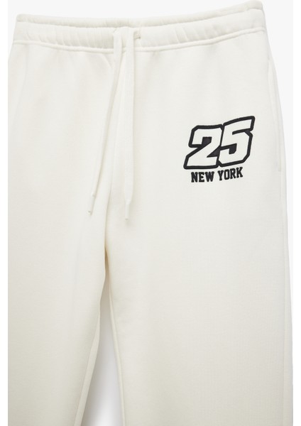 Üç Iplik Şardonlu Cepli Bağcıklı Baskılı Rahat Kalıp Jogger Eşofman Altı indirimleri