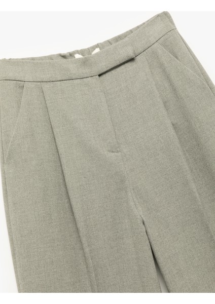 Cepli Pile Detaylı Yüksek Bel Geniş Paça Baggy Kumaş Pantolon modelleri
