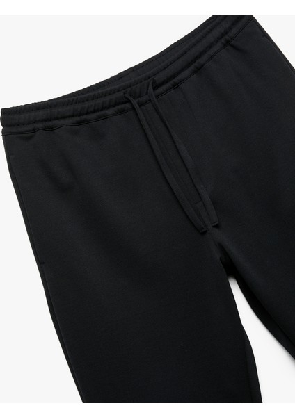 Straight Fit Pike Kumaş Cep Detaylı Beli Bağcıklı Eşofman Görünümlü Pantolon modelleri