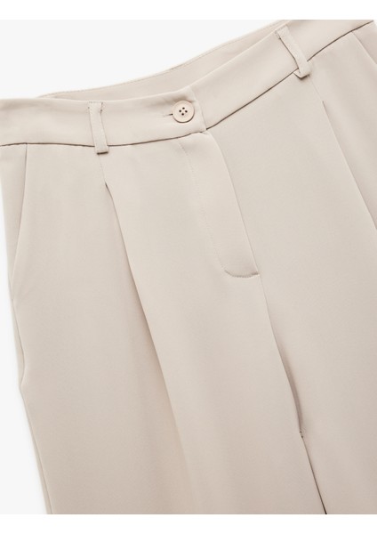 Krep Kumaş Cepli Pile Detaylı Yüksek Bel Geniş Paça Palazzo Pantolon indirimleri