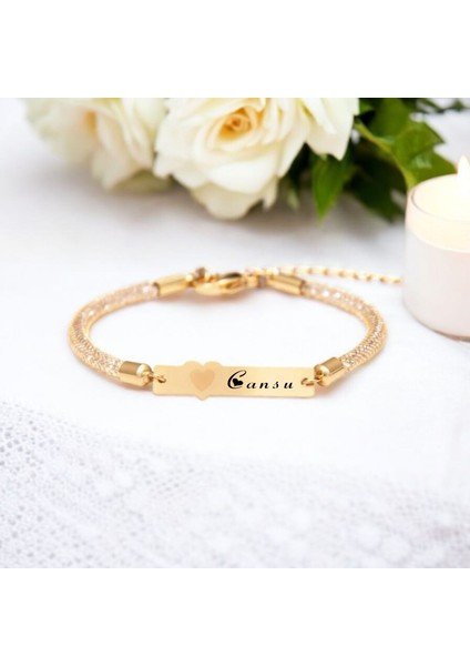 Cansu İsmine Özel Hasır Kordonlu Kalp Motifli 14 Ayar Altın Plakalı Hediye Bileklik-457İsim