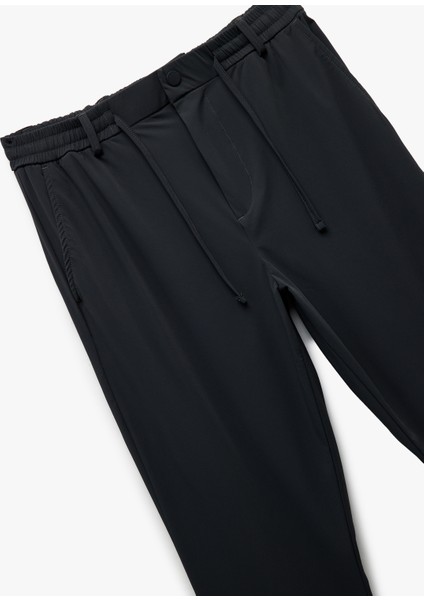 Katlamalı Paça Beli Bağcıklı Düğmeli Esnek Slim Fit Pantolon modelleri