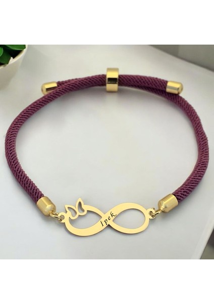 İpek İsmine Özel Sonsuzluk Motifli 14 Ayar Altın Plakalı Mor İpek Örgülü Hediye Bileklik-505 İsim fiyatları