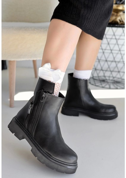 Menta Seri Siyah Suni Deri Dolgu Topuklu Kadın Bot fiyatları