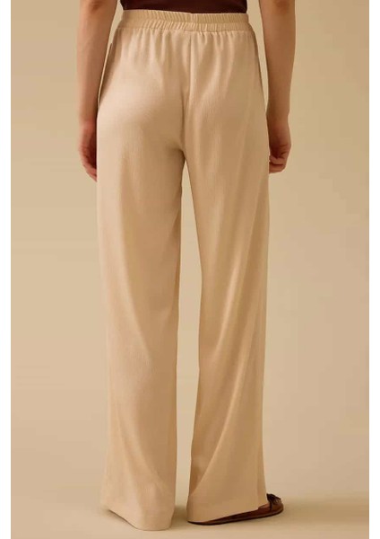Kadın Elastik Bel Dökümlü Bol Paça Pantolon - Bej fırsatları