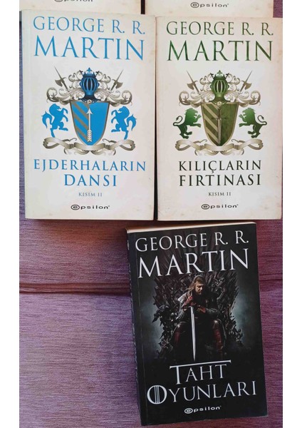 Oyunları - 7 Kitap. Kralların Carpısması 1-2. Kargaların Ziyafeti 1-2. Ejderhaların Dansı 2. Kılıçların Fırtınası. 2. Taht Oyunları Cıldı Olmak Uzere 7 Kıtap