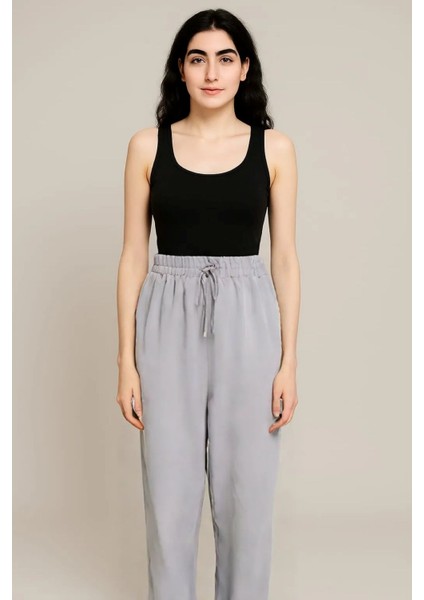 Kadın Jogger Kompakt Parlak Kumaş Yan Cepli Lastikli Paça Geniş Kesim Pijama Altı