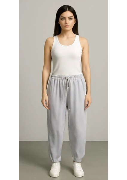 Kadın Jogger Kompakt Parlak Kumaş Yan Cepli Lastikli Paça Geniş Kesim Pijama Altı