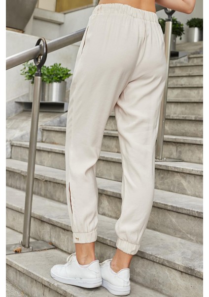 Kadın Ipeksi Modal Kumaş Yüksek Bel Yan Cepli Paçası ve Beli Lastikli Havuç Kesim Pantolon-Bej fırsatları