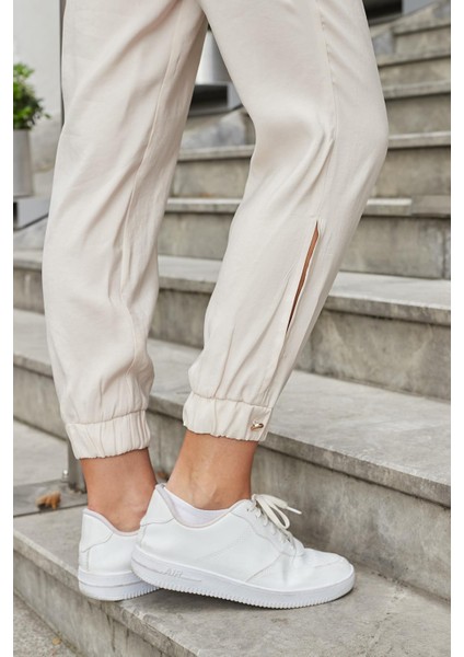 Kadın Ipeksi Modal Kumaş Yüksek Bel Yan Cepli Paçası ve Beli Lastikli Havuç Kesim Pantolon-Bej indirimleri